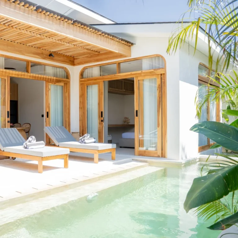 Luxury villa with private pool in Kuta Lombok, tropical terrace with sun loungers and modern Mediterranean design